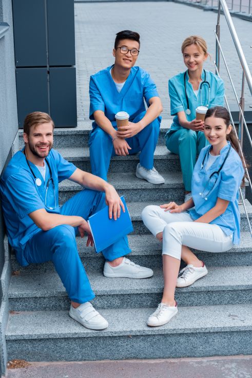 smiling-multicultural-medical-students-sitting-on-2024-11-10-18-26-17-utc (1)